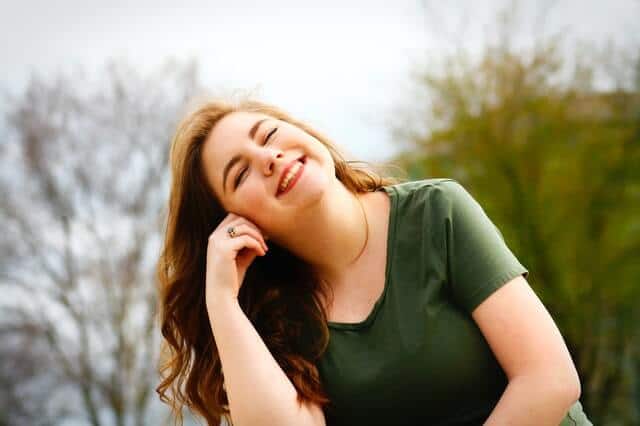 woman-in-green-shirt-smiling